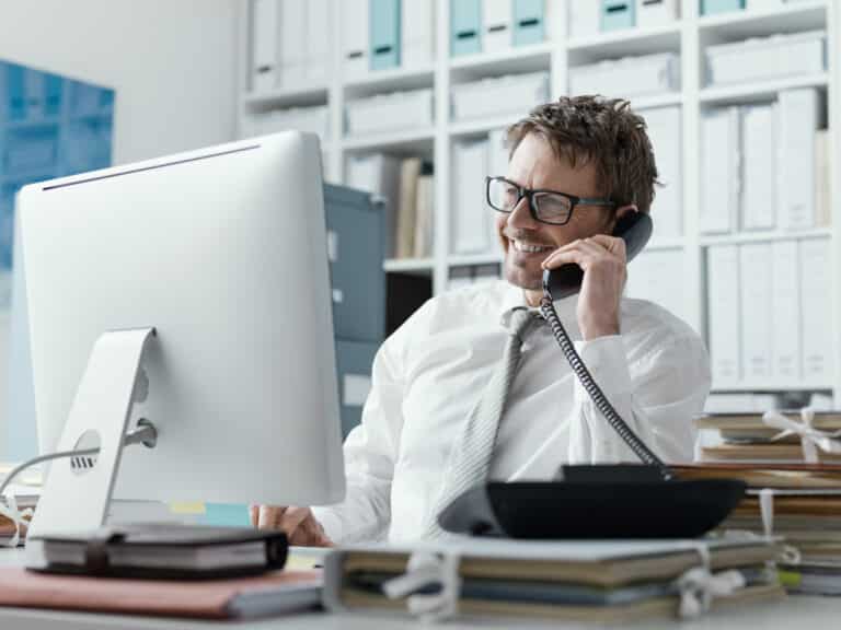 Confident happy business executive on the phone
